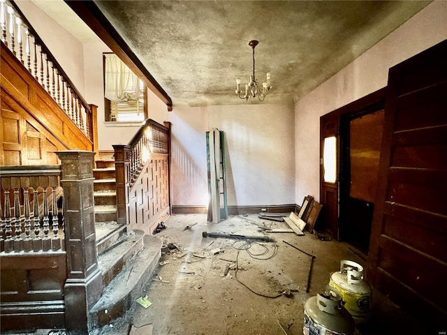 5174 Cabanne Ave, Saint Louis, MO 63113 - interior space featuring stairs and a chandelier