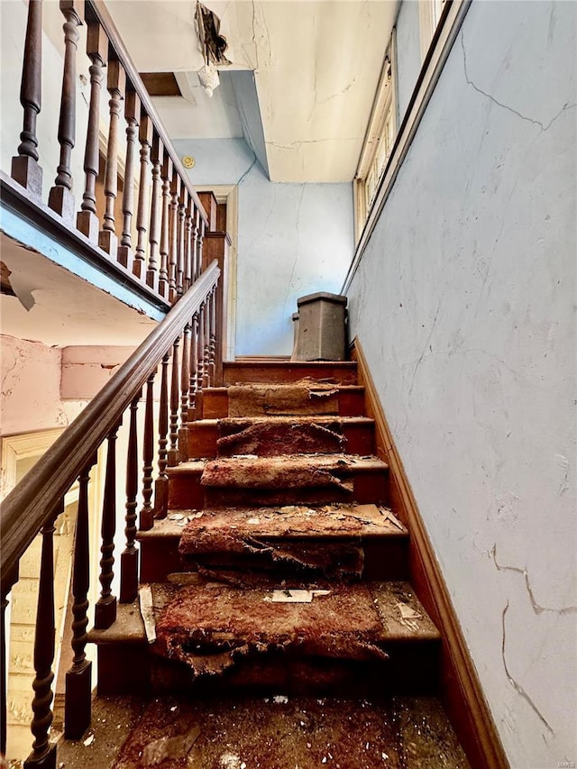 5174 Cabanne Ave, Saint Louis, MO 63113 - staircase featuring a high ceiling