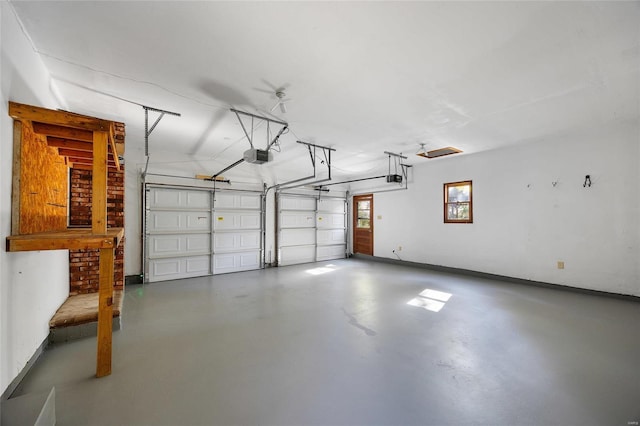 1145 Danby Rd, Festus, MO 63028 - garage with a garage door opener and baseboards