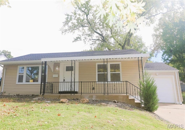 8912 Boyce Pl, Saint Louis, MO 63136 - single story home with a porch, an attached garage, a front yard, and driveway