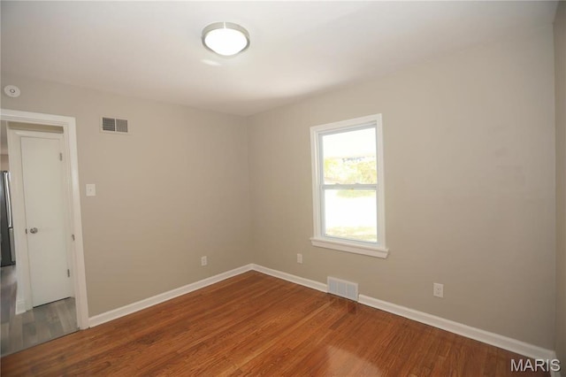 8912 Boyce Pl, Saint Louis, MO 63136 - empty room featuring baseboards and wood finished floors