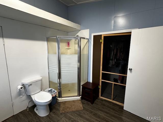 699 State Highway V, Sturdivant, MO 63782 - full bath with toilet, a shower stall, wood finished floors, and a closet