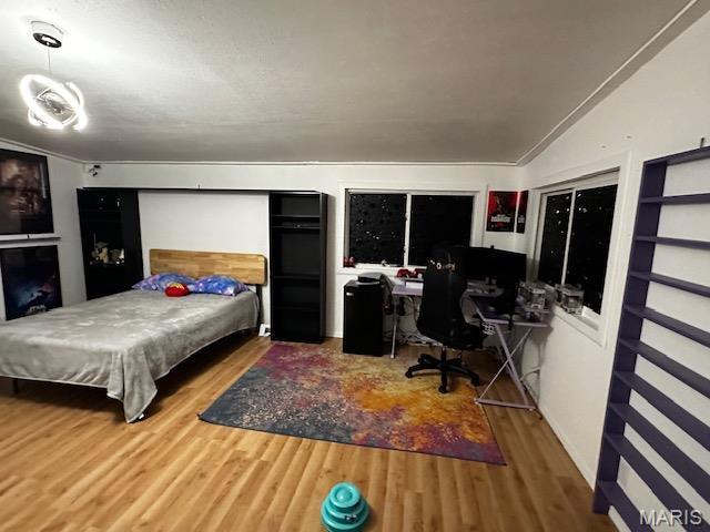 699 State Highway V, Sturdivant, MO 63782 - bedroom with wood finished floors, an office area, and lofted ceiling
