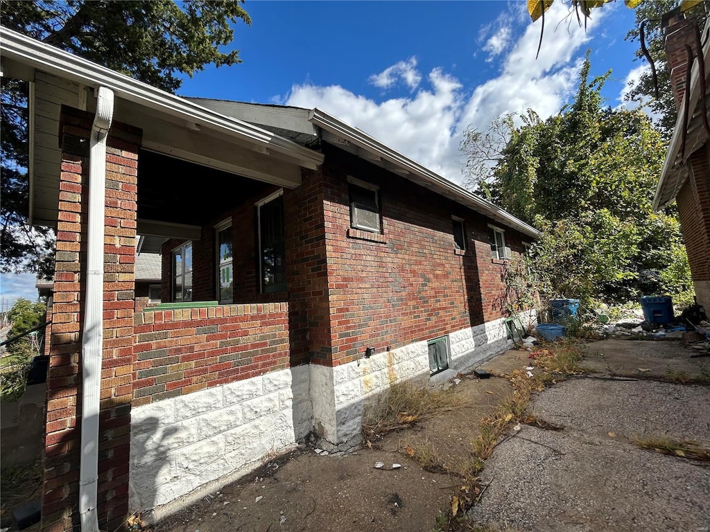 4228 Jennings Station Rd, Saint Louis, MO 63121 - view of side of property featuring brick siding