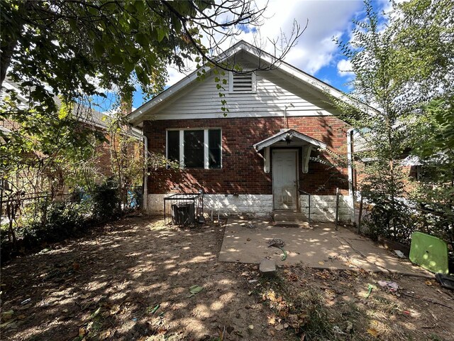 4228 Jennings Station Rd, Saint Louis, MO 63121 - view of front of property with brick siding and a patio