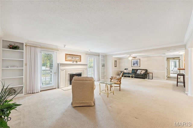964 Claytonbrook Dr Unit 2A, Ballwin, MO 63011 - living room featuring crown molding, a textured ceiling, carpet, a fireplace, and built in features