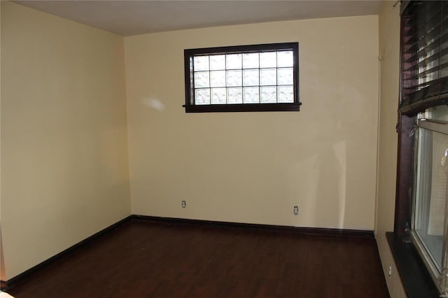 11814 Bellefontaine Rd, Saint Louis, MO 63138 - unfurnished room with dark wood finished floors and baseboards