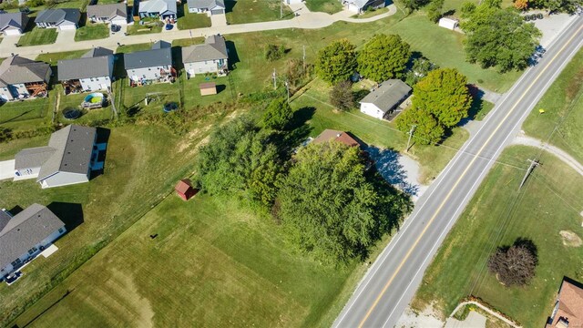 aerial view of property and surrounding area with nearby suburban area