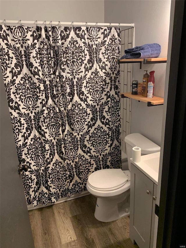 11821 Larimore Rd, Saint Louis, MO 63138 - bathroom with wood finished floors, a shower with curtain, toilet, and vanity