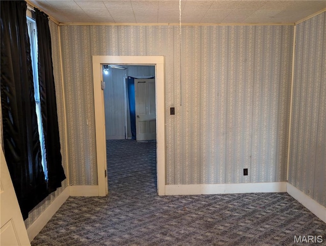 carpeted empty room with ornamental molding