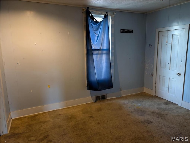 entrance foyer with carpet floors and baseboards