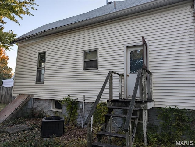 view of side of home with cooling unit