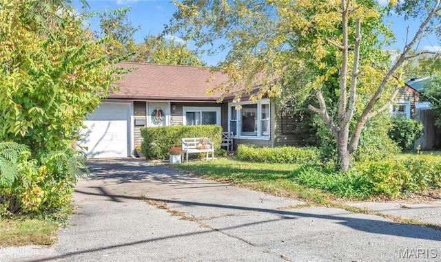 11409 Manchester Rd, Saint Louis, MO 63122 - view of front of home with a garage and driveway