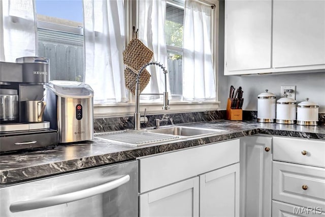 11409 Manchester Rd, Saint Louis, MO 63122 - kitchen with dishwasher, white cabinetry, dark countertops, and a sink
