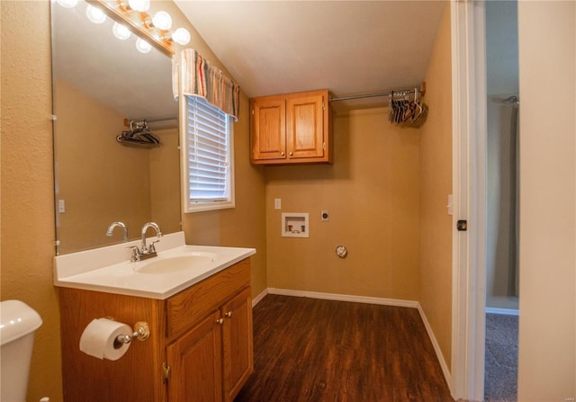 12191 County Road 637, Dexter, MO 63841 - bathroom featuring wood finished floors, vanity, baseboards, and toilet
