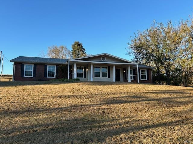 13825 Old Wire Outer Rd, Rolla, MO 65401 - ranch-style home with a front lawn and covered porch