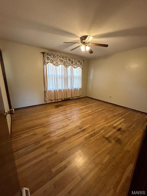 13825 Old Wire Outer Rd, Rolla, MO 65401 - spare room with a ceiling fan and wood finished floors