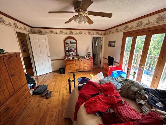 bedroom featuring access to outside, french doors, light wood-type flooring, ornamental molding, and ceiling fan