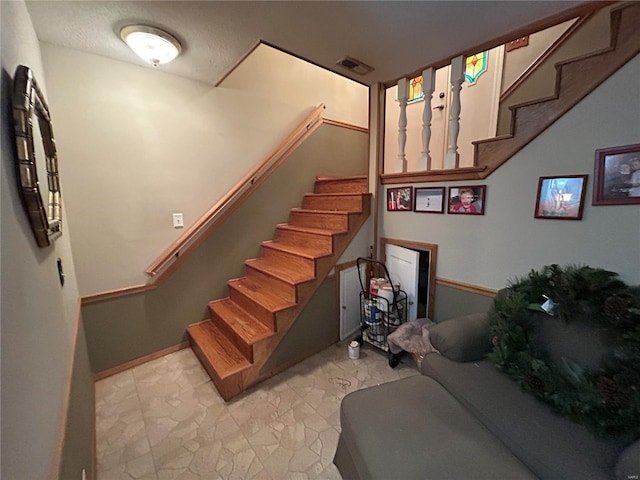 stairs featuring baseboards