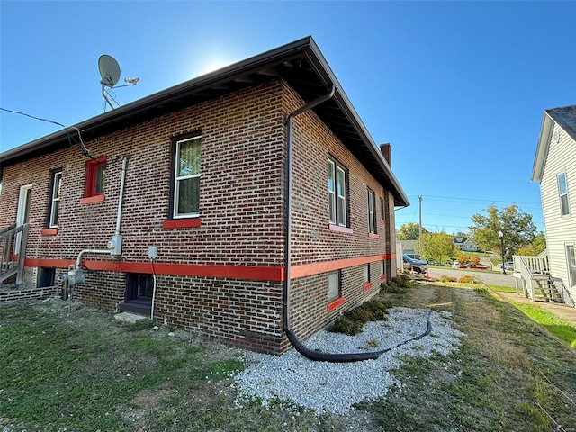 203 W Booneslick Rd, Warrenton, MO 63383 - view of side of property with brick siding and a chimney