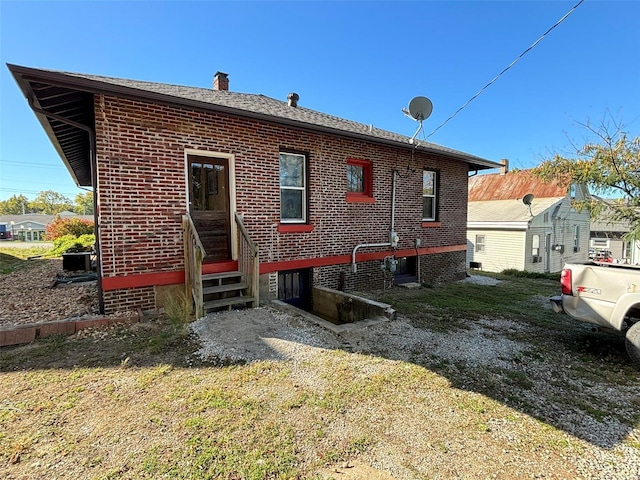 203 W Booneslick Rd, Warrenton, MO 63383 - back of property with a chimney and brick siding