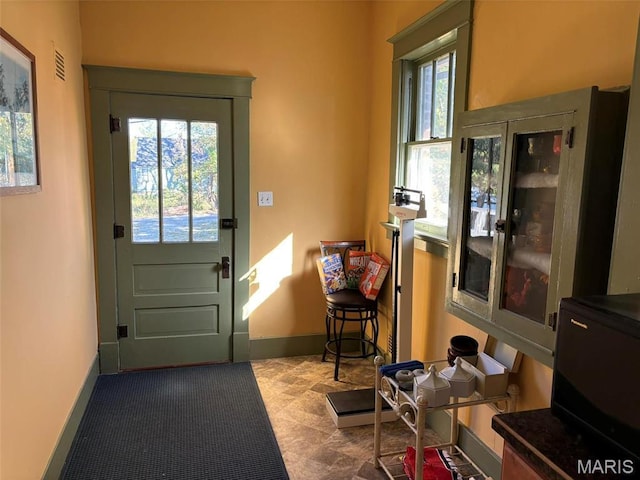 203 W Booneslick Rd, Warrenton, MO 63383 - doorway to outside featuring baseboards