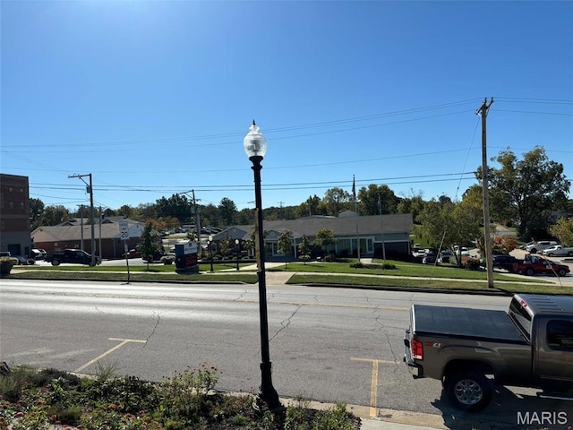 203 W Booneslick Rd, Warrenton, MO 63383 - view of asphalt road with sidewalks, street lighting, curbs, and a residential view