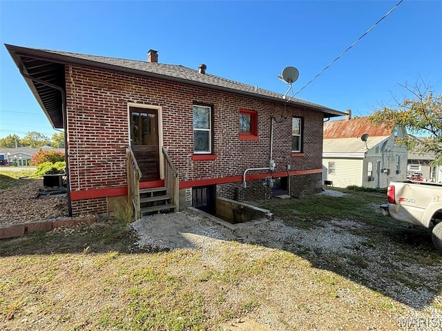203 W Booneslick Rd, Warrenton, MO 63383 - back of property with a chimney and brick siding