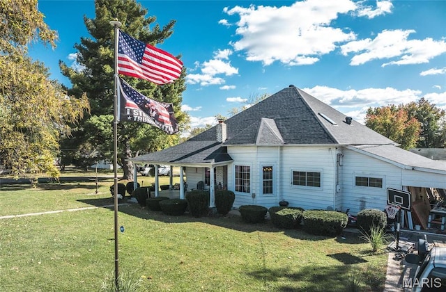 401 W Gibbs, Salem, MO 65560 - view of home's exterior featuring a yard, a shingled roof, and a patio