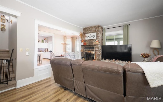 401 W Gibbs, Salem, MO 65560 - living room featuring ornamental molding, wood finished floors, a fireplace, and baseboards