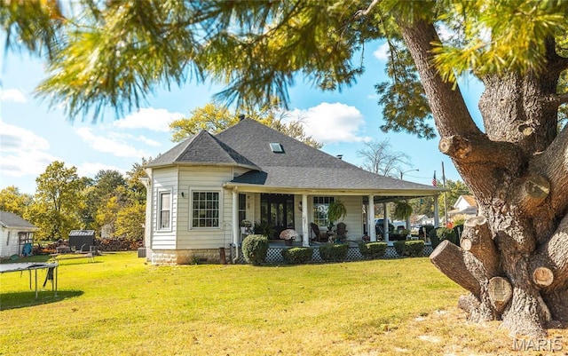 401 W Gibbs, Salem, MO 65560 - view of front of home featuring a trampoline, a front yard, and a shingled roof