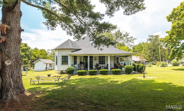 401 W Gibbs, Salem, MO 65560 - view of front of home featuring a porch, a front lawn, and roof with shingles