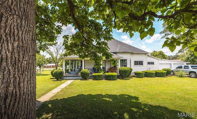 401 W Gibbs, Salem, MO 65560 - view of front of home with a garage, covered porch, a front yard, and roof with shingles