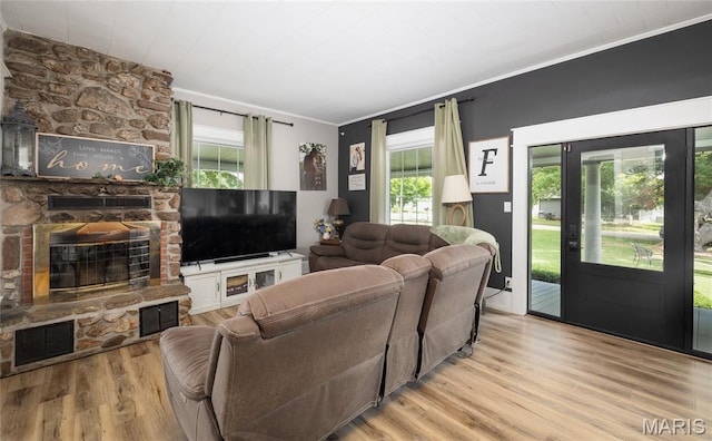 401 W Gibbs, Salem, MO 65560 - living room with crown molding, wood finished floors, and a fireplace