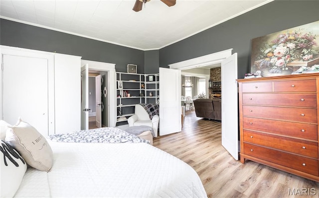 401 W Gibbs, Salem, MO 65560 - bedroom with wood finished floors, ornamental molding, and a ceiling fan