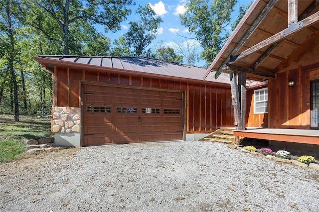 11336 Choctaw Cir, Saint Genevieve, MO 63670 - view of home's exterior with metal roof, stone siding, and a standing seam roof