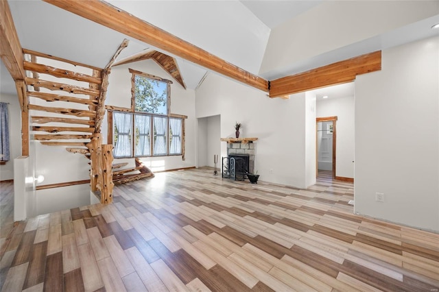 11336 Choctaw Cir, Saint Genevieve, MO 63670 - unfurnished living room featuring high vaulted ceiling and wood finished floors
