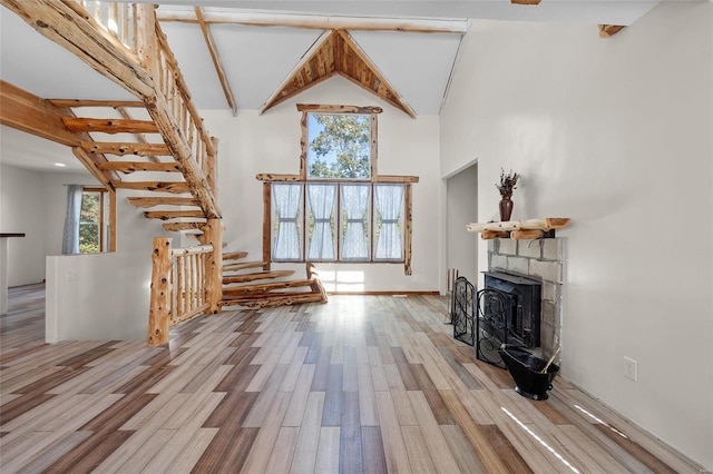 11336 Choctaw Cir, Saint Genevieve, MO 63670 - living room featuring high vaulted ceiling, wood finished floors, and beamed ceiling