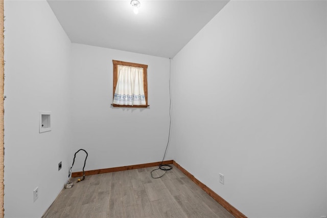 11336 Choctaw Cir, Saint Genevieve, MO 63670 - clothes washing area with washer hookup, light wood-style floors, baseboards, and gas dryer hookup