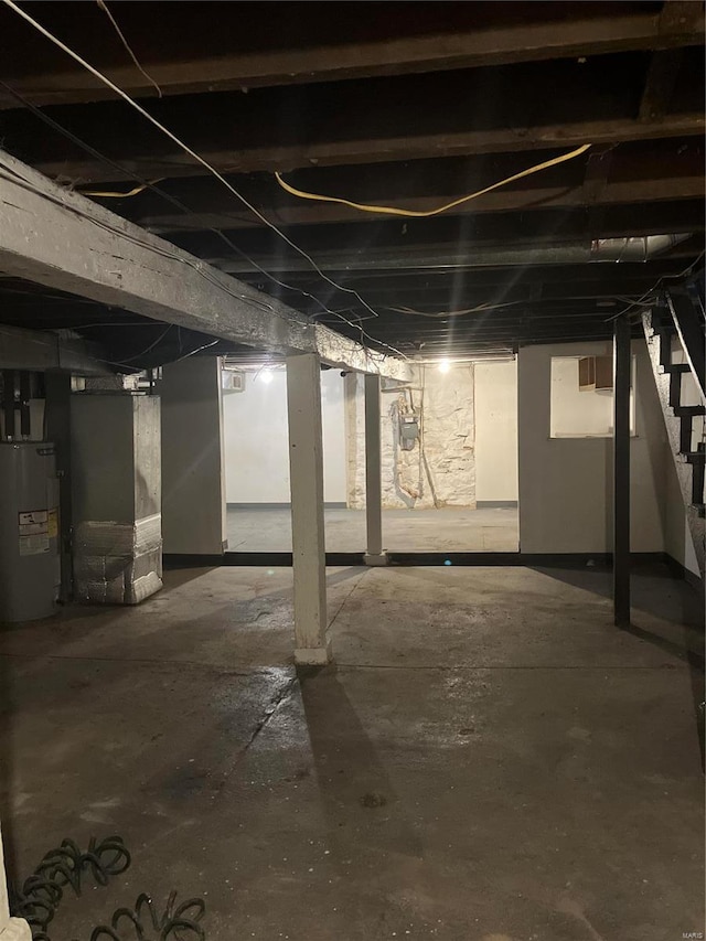 5875 Lotus Ave, Saint Louis, MO 63112 - unfinished basement featuring water heater, stairs, gas meter, and heating unit