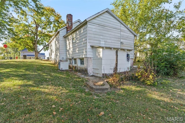 32 Summit St, Bonne Terre, MO 63628 - view of side of home with a lawn and a chimney