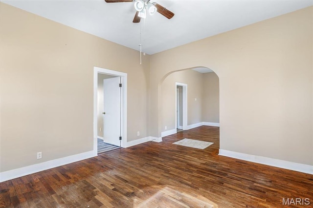32 Summit St, Bonne Terre, MO 63628 - empty room with ceiling fan, arched walkways, baseboards, and wood finished floors