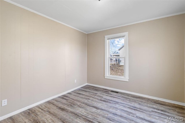 32 Summit St, Bonne Terre, MO 63628 - spare room with wood finished floors, baseboards, and crown molding