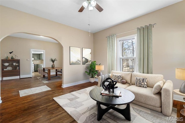 32 Summit St, Bonne Terre, MO 63628 - living area featuring arched walkways, wood finished floors, ceiling fan, and baseboards