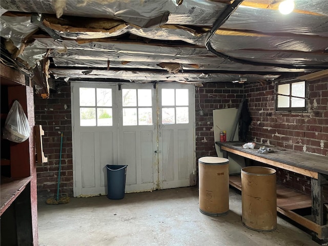 below grade area with brick wall