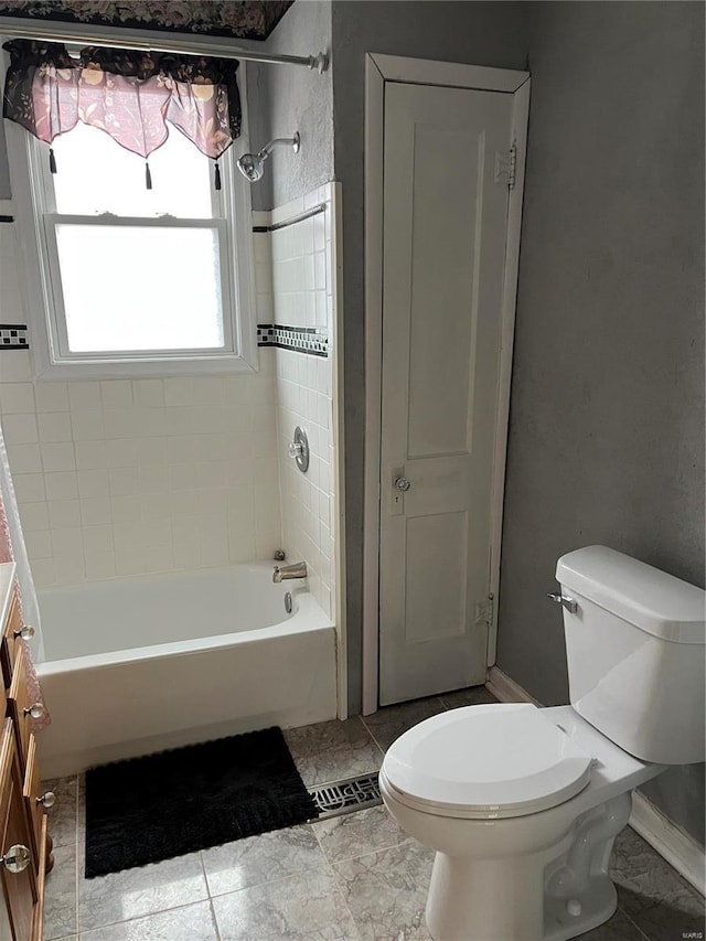 full bath with toilet, bathtub / shower combination, vanity, and baseboards