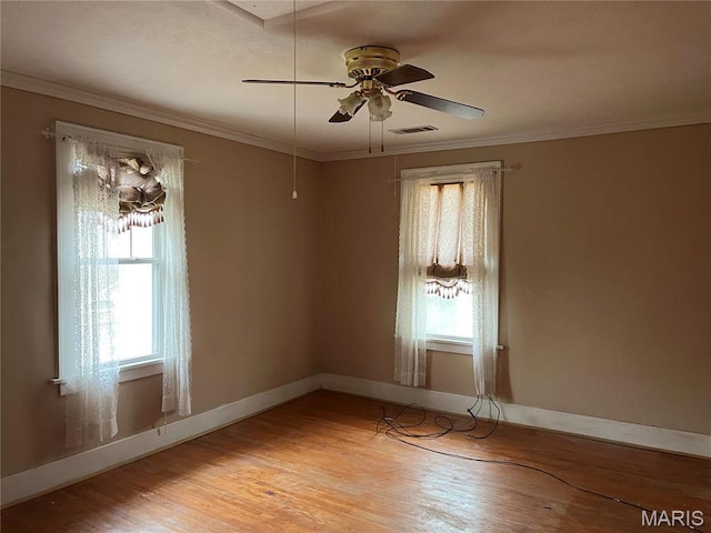 611 W Main St, Staunton, IL 62088 - unfurnished room with light wood-style flooring, a ceiling fan, baseboards, and ornamental molding