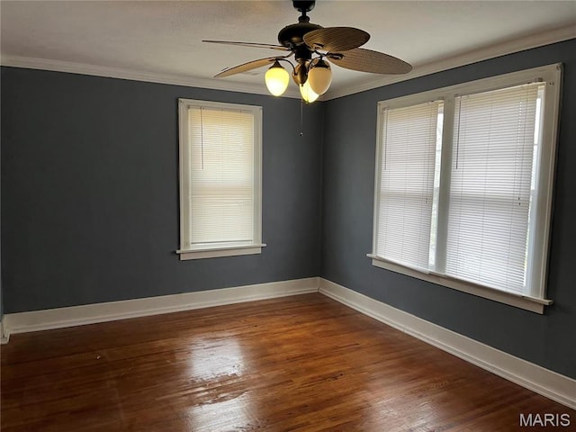 611 W Main St, Staunton, IL 62088 - unfurnished room with crown molding, wood finished floors, ceiling fan, and baseboards