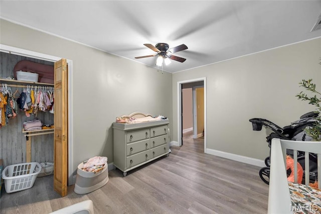 10410 Business 21, Hillsboro, MO 63050 - bedroom with wood finished floors, baseboards, a closet, and ceiling fan