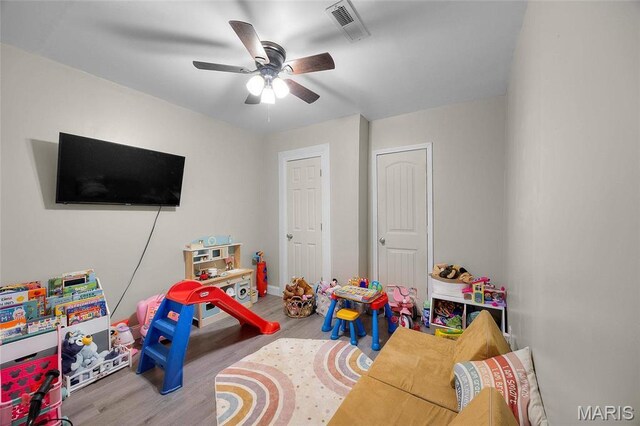 10410 Business 21, Hillsboro, MO 63050 - playroom featuring wood finished floors, ceiling fan, and baseboards